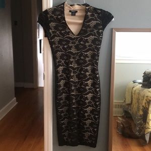 Size small black lace fitted dress with nude liner